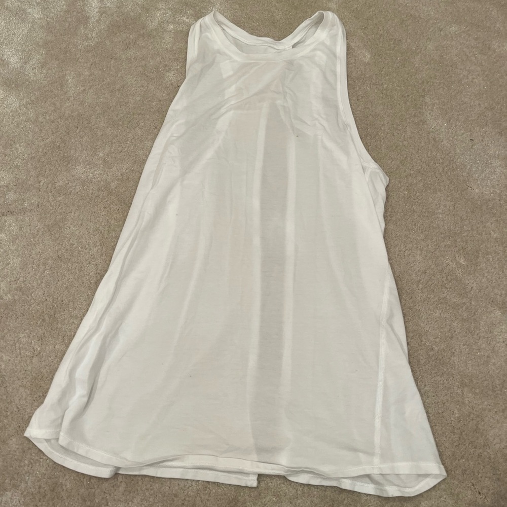 White razorback lululemon tank with open slit in back